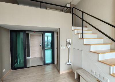 Modern building interior with open staircase and entryway
