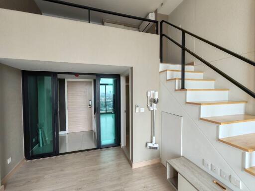 Modern building interior with open staircase and entryway