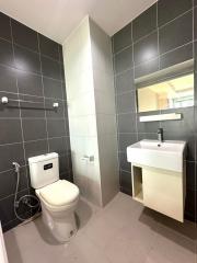Modern bathroom with tiled walls and flooring