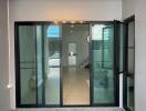 Elegant home entrance with glass doors and modern lighting