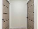 Modern hallway with wooden floors and white walls