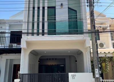 Modern two-story house with a large gate