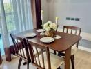 Elegant dining room with a wooden table set and a view