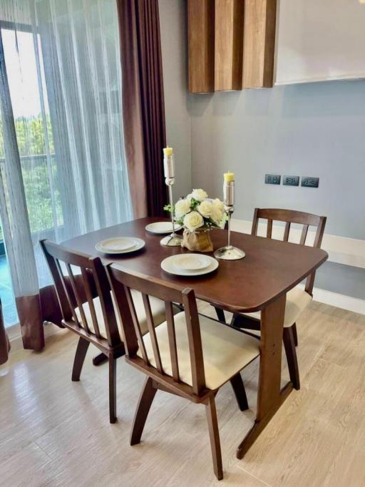 Elegant dining room with a wooden table set and a view