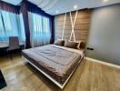 Modern bedroom with large bed and wooden accent wall