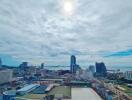 Panoramic cityscape with ocean view under blue skies