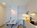 Modern kitchen with dining area in a bright apartment