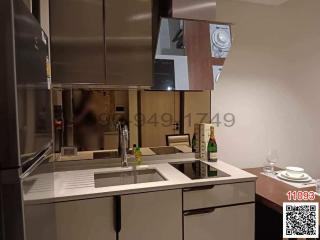 Modern kitchen with stainless steel appliances and minimalist design