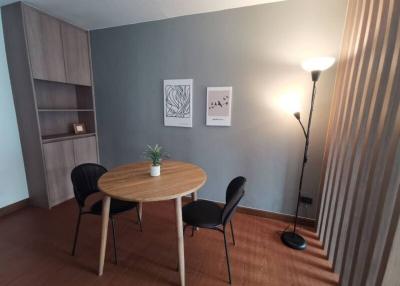 Cozy modern dining area with wooden table and chairs