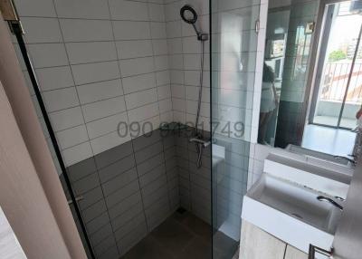 Modern bathroom with walk-in shower and vanity sink