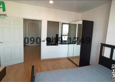 Spacious bedroom with queen-sized bed and large wardrobe