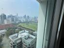 Cityscape view from a high-rise apartment building window