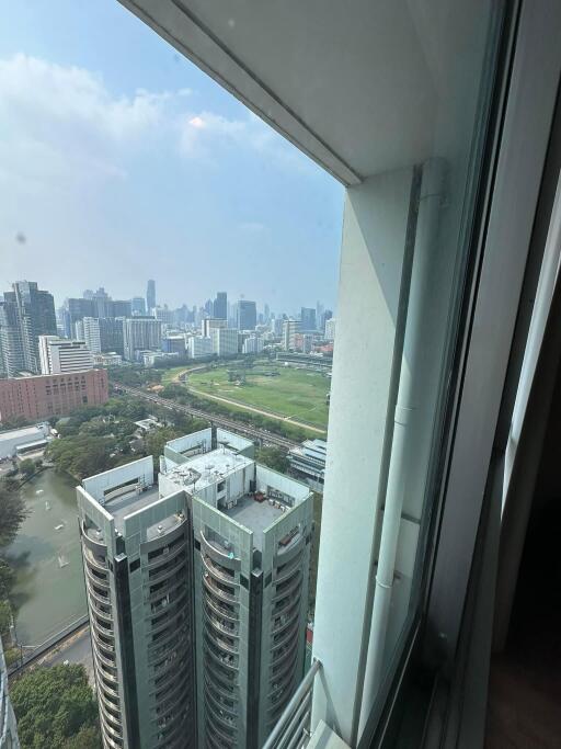 Cityscape view from a high-rise apartment building window