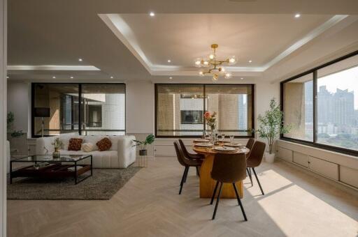 Modern open-plan living and dining area with ample natural light