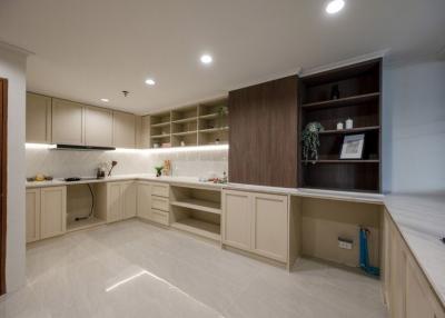 Modern kitchen with ample counter space and built-in shelves