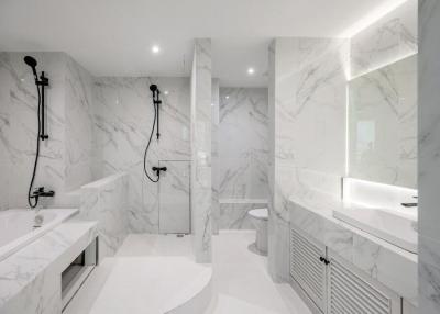 Modern bathroom with marble tiles and high-end fixtures