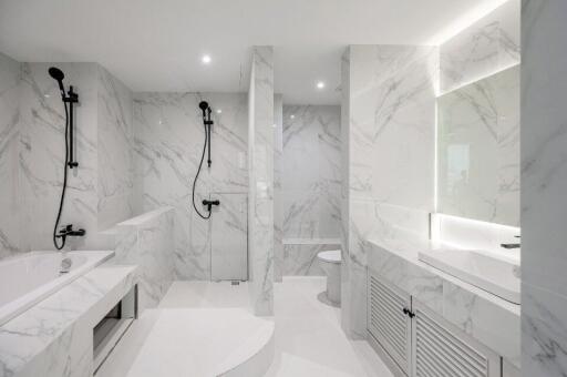 Modern bathroom with marble tiles and high-end fixtures