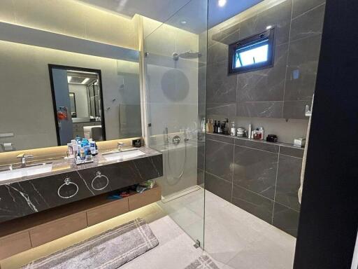 Modern bathroom with walk-in shower and double vanity