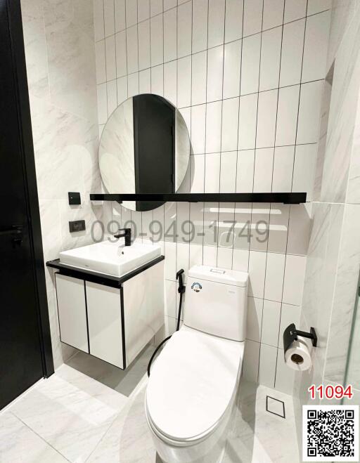 Modern bathroom with elegant fixtures and marble tiling