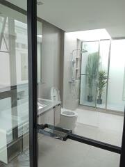 Modern bathroom with glass shower enclosure and clean design