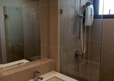 Modern bathroom with glass shower and stylish basin
