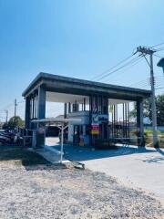 Unfinished concrete building structure under clear blue sky