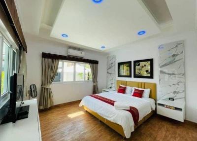 Modern bedroom with ample lighting and contemporary design