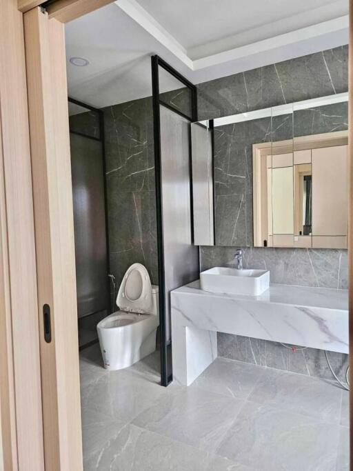 Modern bathroom interior with glass shower partition