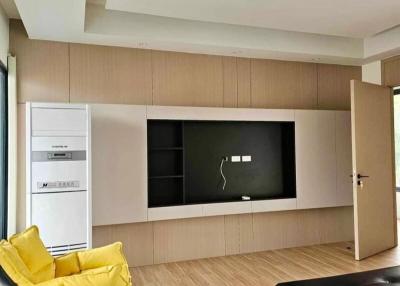 Modern living room with minimalist furniture and built-in shelves