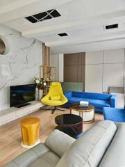 Modern living room interior with vibrant furniture and elegant design