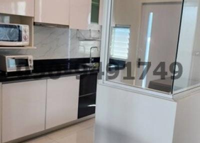 Modern kitchen with integrated appliances and white cabinetry