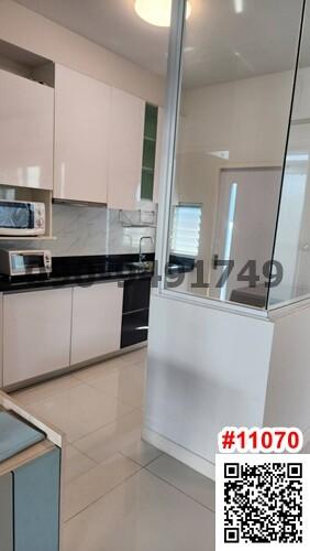 Modern kitchen with integrated appliances and white cabinetry