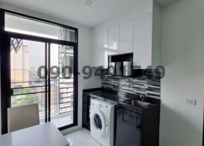 Modern kitchen with laundry area