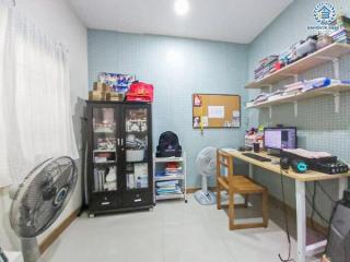 Home office with desk, shelves, and storage unit