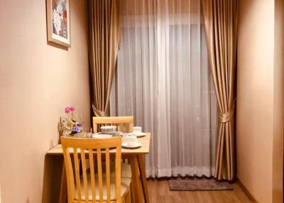 Cozy dining space with wooden table and chairs