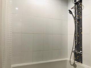 Modern bathroom with wall-mounted shower