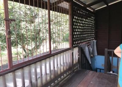 Cozy wooden patio with ample seating area and natural surroundings