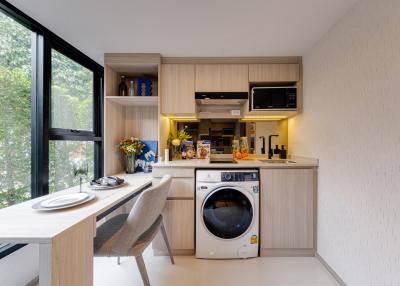 Modern combined kitchen and dining area with natural light