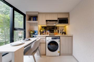 Modern combined kitchen and dining area with natural light