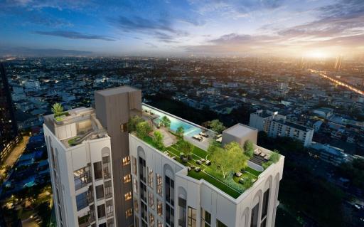 Modern high-rise residential building with rooftop amenities at dusk