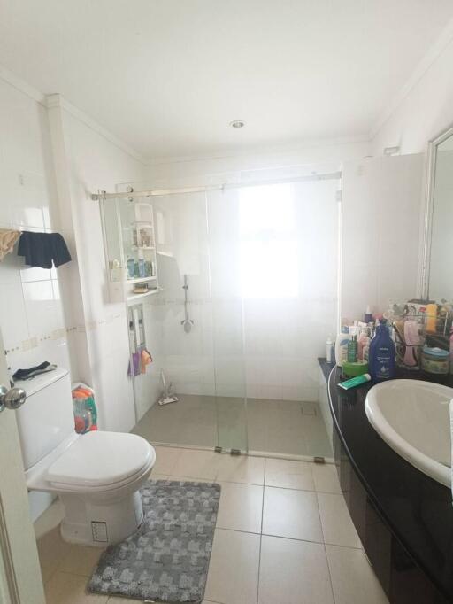 Bright bathroom with glass shower and modern fixtures