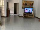 Spacious living room with tiled flooring and natural light