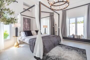 Elegant bedroom with four-poster bed and modern decor