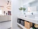 Modern bathroom interior with double sink and view into living room area