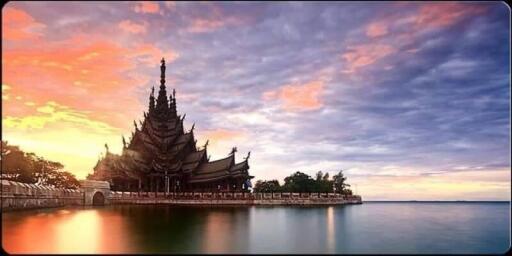Traditional architecture by the water at sunset