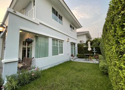 Cozy suburban house exterior with well-maintained garden