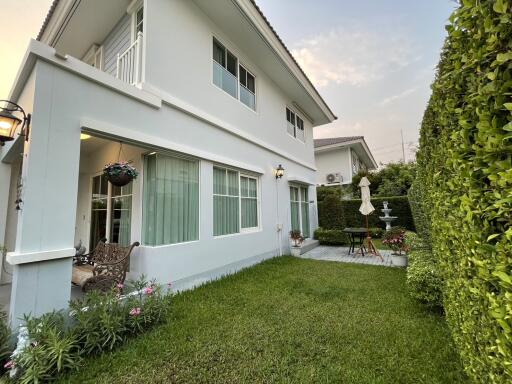 Cozy suburban house exterior with well-maintained garden