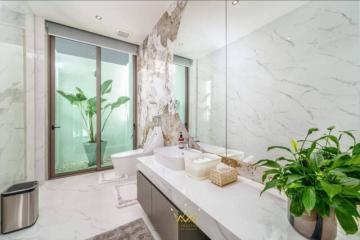 Modern bathroom with marble finish and natural light