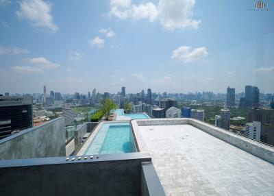 Rooftop swimming pool with panoramic city skyline view