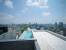 Rooftop swimming pool with panoramic city skyline view